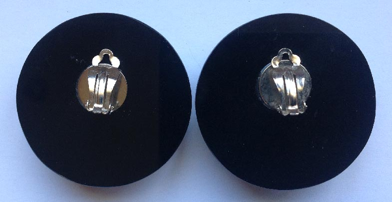 pair retro circa 1980's large black and white plastic clip on earrings